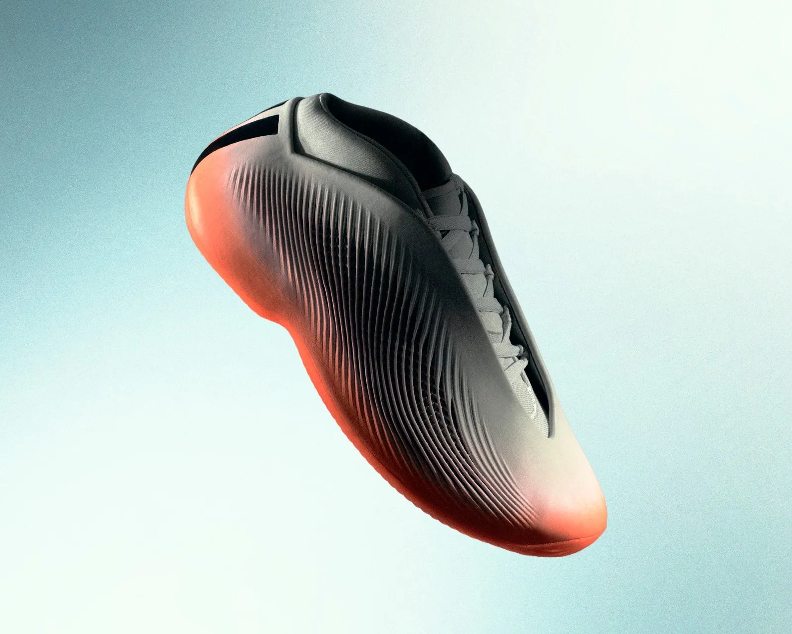 Futuristic gray sneaker with ribbed texture and glowing orange sole against a light gradient background.