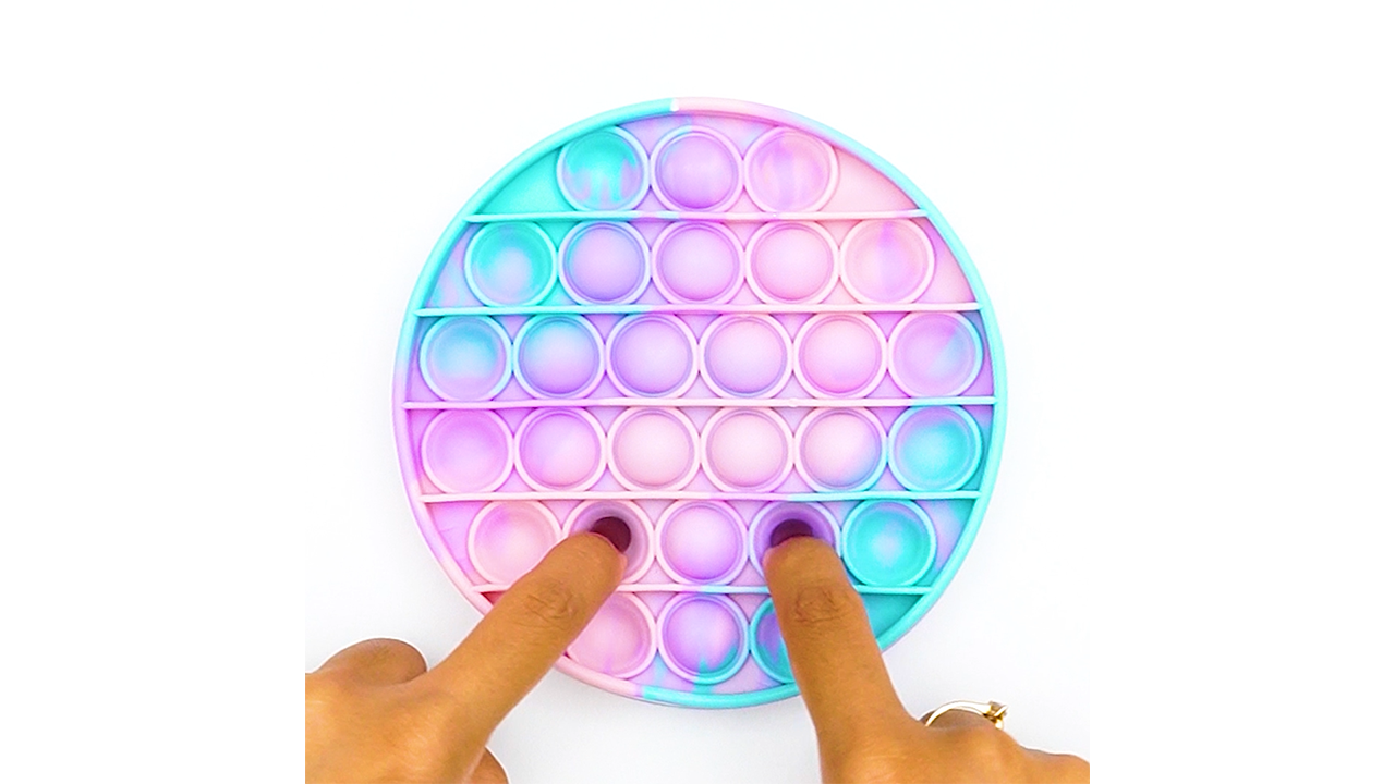 Pressing a pastel marble circle pop it with smooth bubble texture