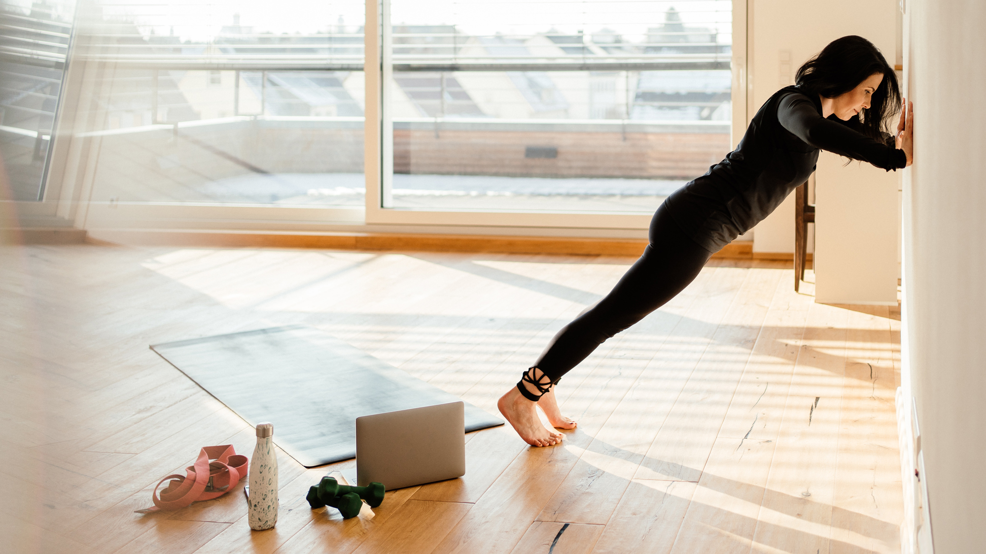 Woman doing wall push-ups