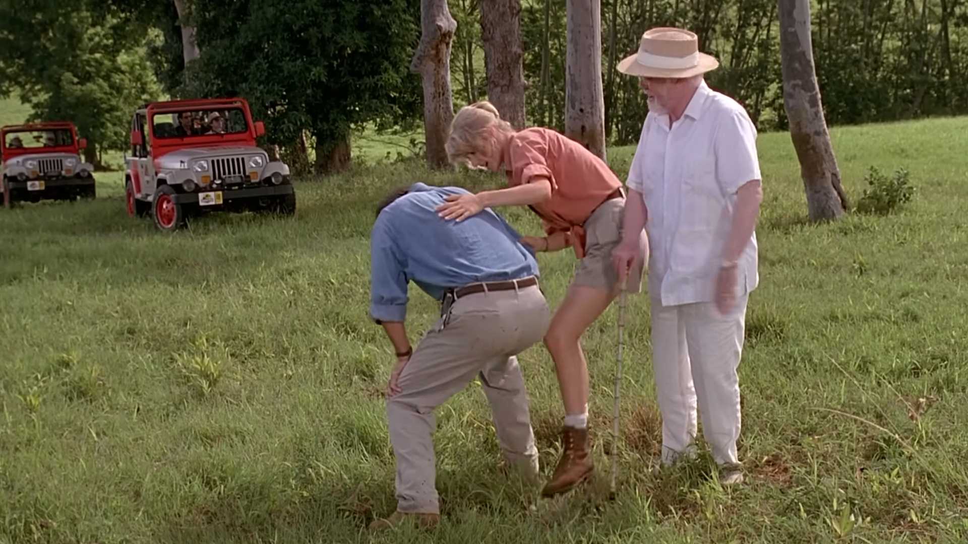 Ellie (Laura Dern) looking after Alan (Sam Neill) whose about to faint in Jurassic Park