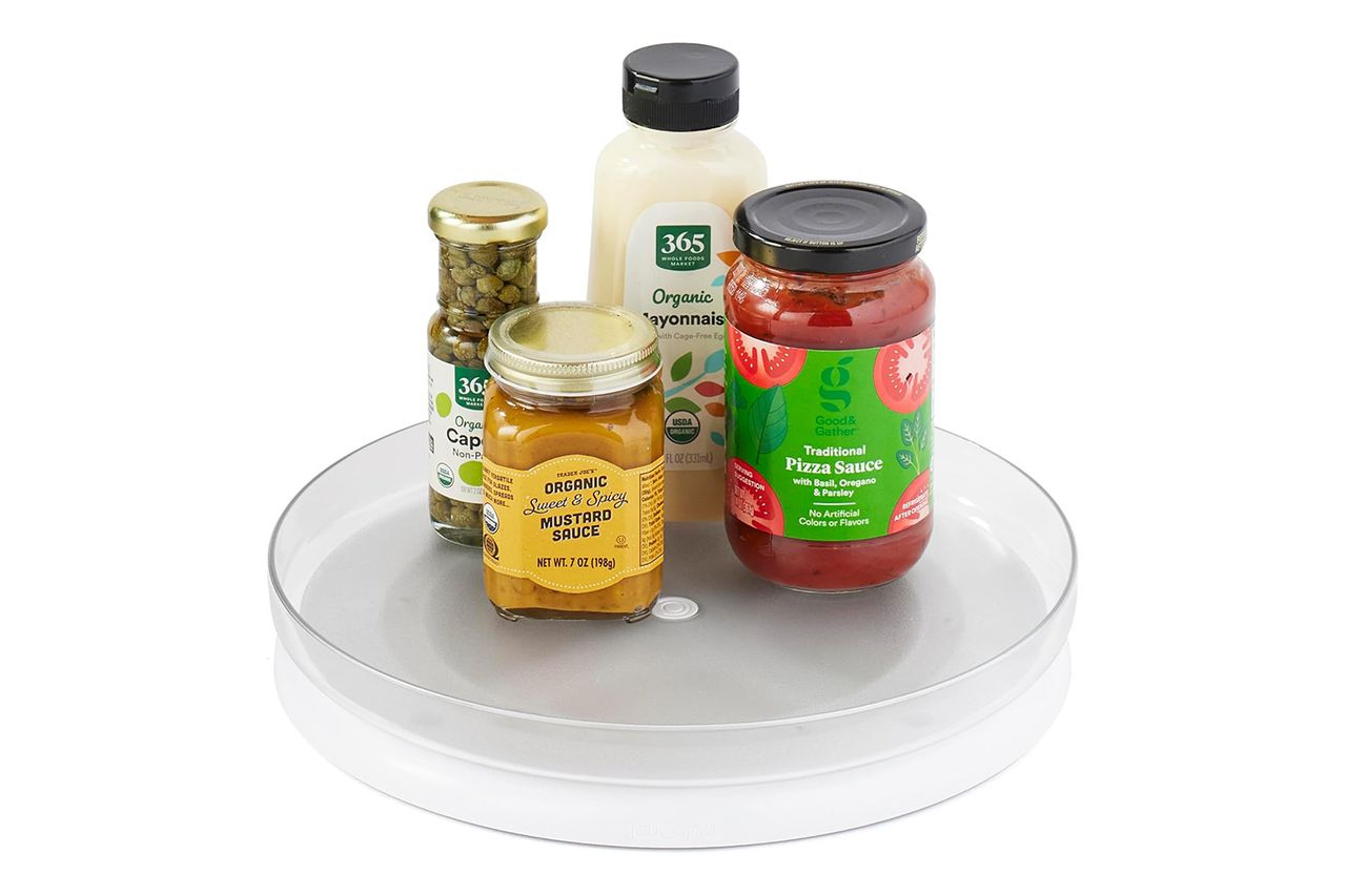 A lazy Susan with food items including jars and bottles from 365 brand