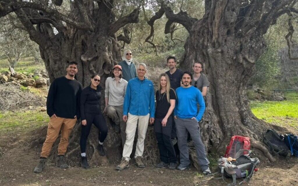 Klil Halevi (far left) poses with other researchers from the laboratory of Prof. Ron Milo (center, in blue top) located at the Weizmann Institute of Science in Rehovot. (Courtesy)