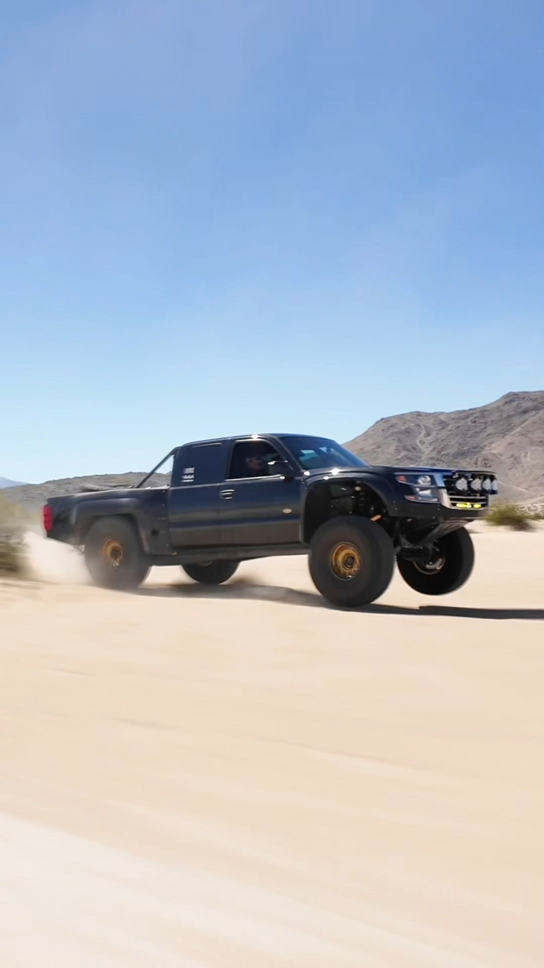 Chevy pre-runner truck takes a huge off-road jump
