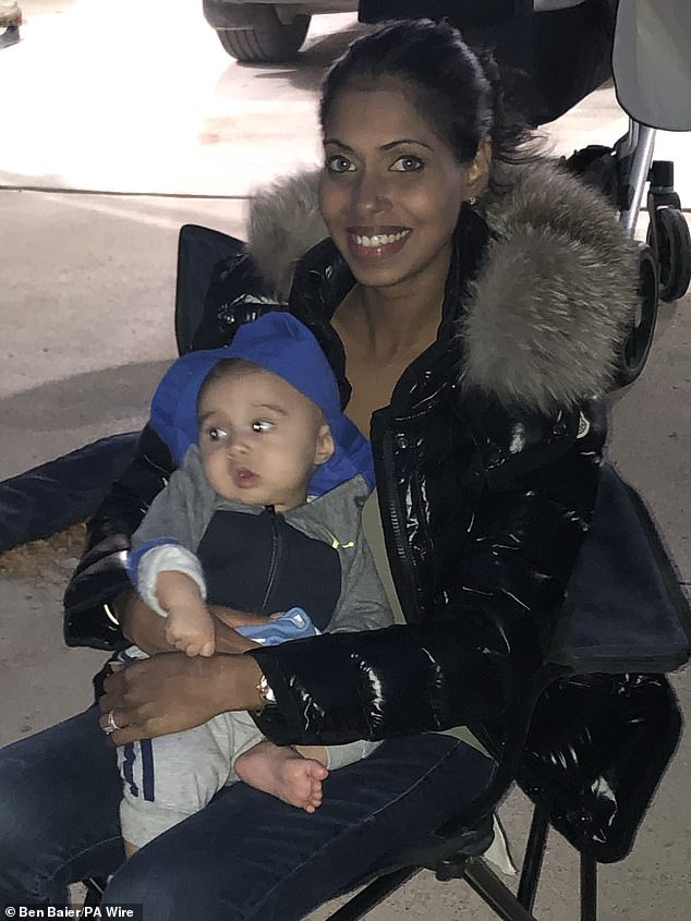 Ms Samaratunga holding their son Blaine as a baby