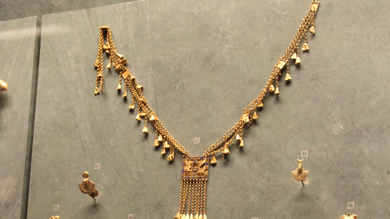 A 2,600-year-old Egyptian jewelry stash held a tiny gold statue of three gods