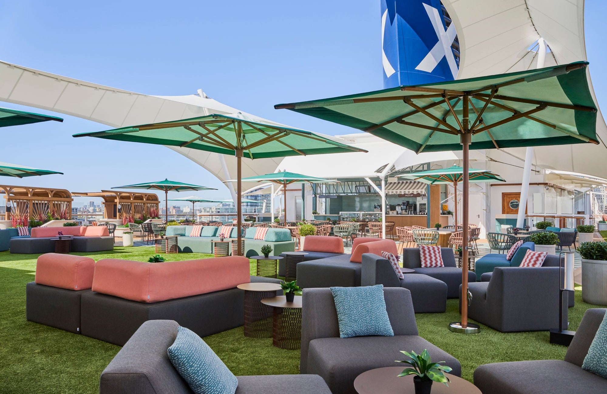 Sunset Park features a vast open-air space with ample seating to watch the mountainous landscapes on an Alaskan sailing (Celebrity Cruises)