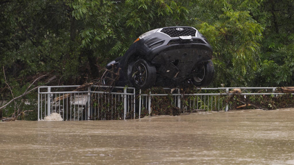 Floods surge in Texas Hill Country after huge rainstorms, as rescuers pull people from rising waters