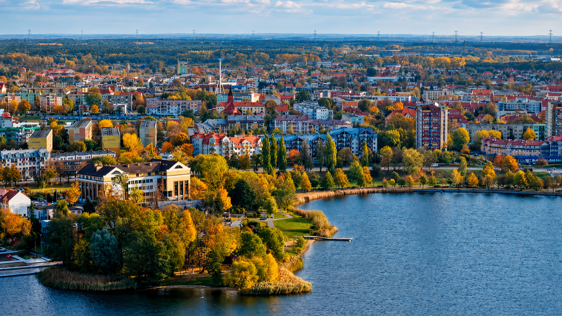 Elk Lake’s lakefront skyline surrounded by autumn trees