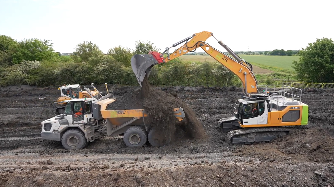 Heavy earthmoving equipment demonstrates fast and precise loading ...