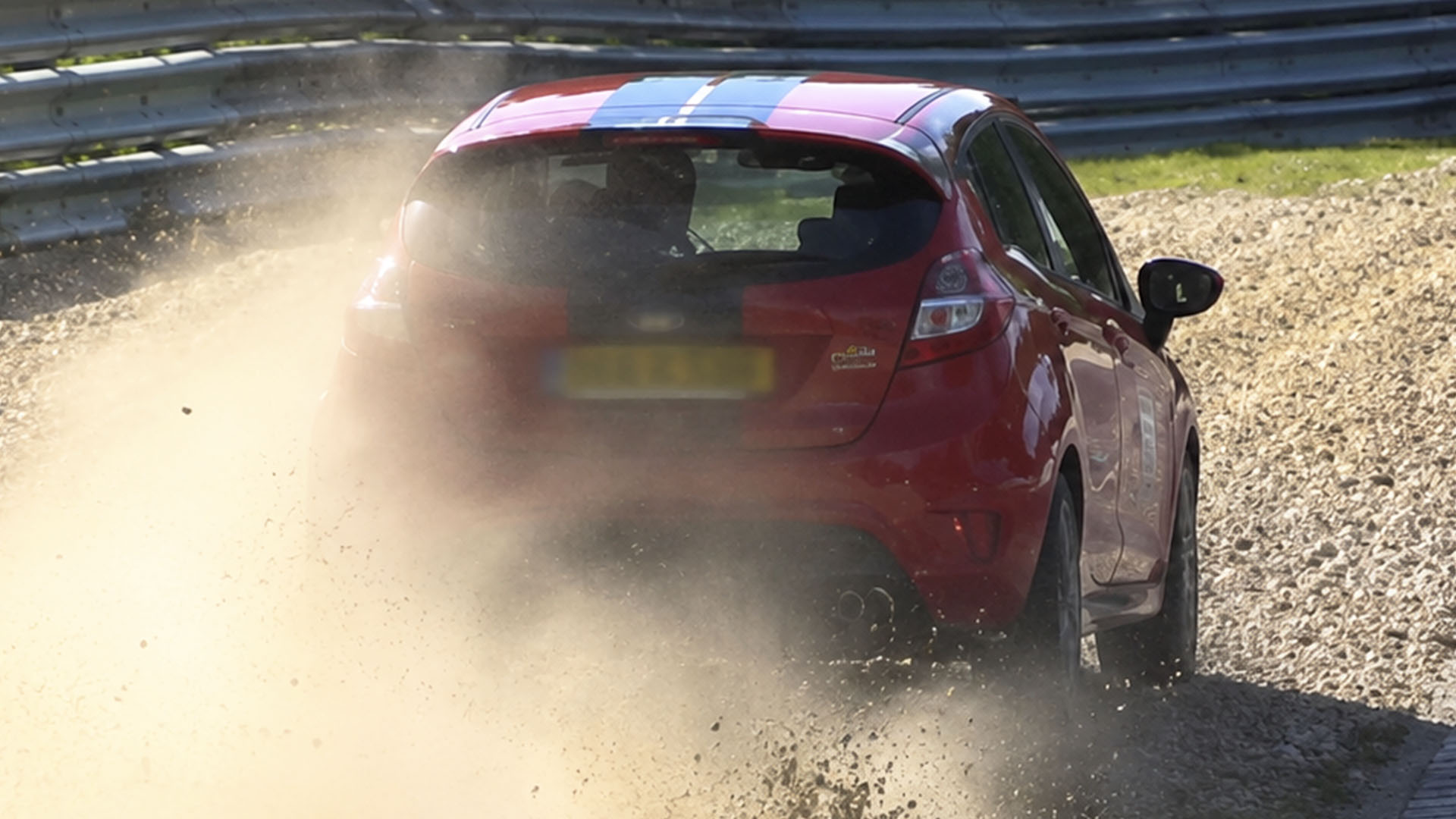 Rental driver avoids bigger crash after running wide at Nürburgring corner