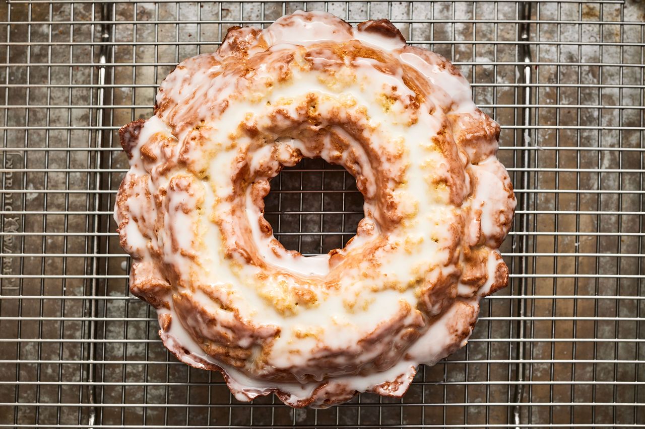 Southern Living Glazed Buttermilk Donut Cake glazed on a cooling rack