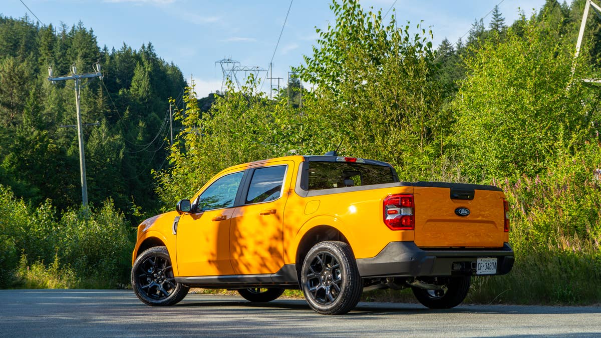 2026-ford-maverick-lariat-hybrid-in-orange-fury-rear-angled-view