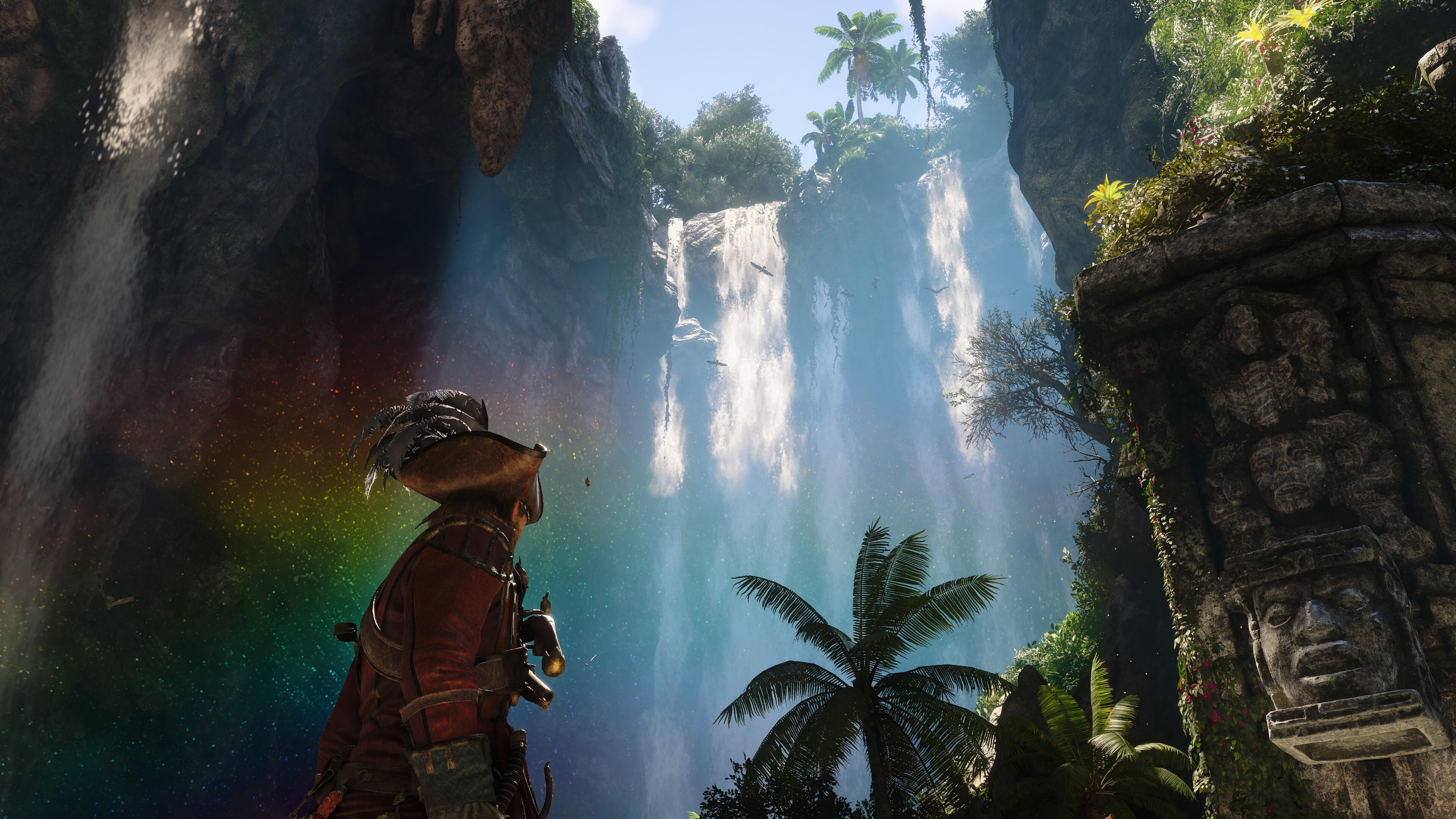 Assassin's Creed Black Flag Resynced gameplay showing Edward Kenway looking up at a huge waterfall that casts a shimmering rainbow