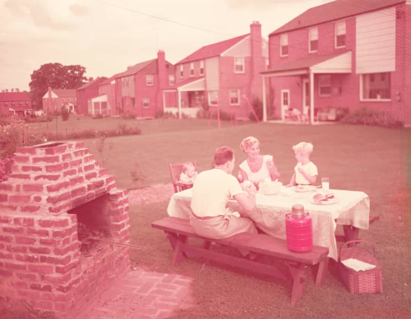 Family having picnic and grill in backyard.