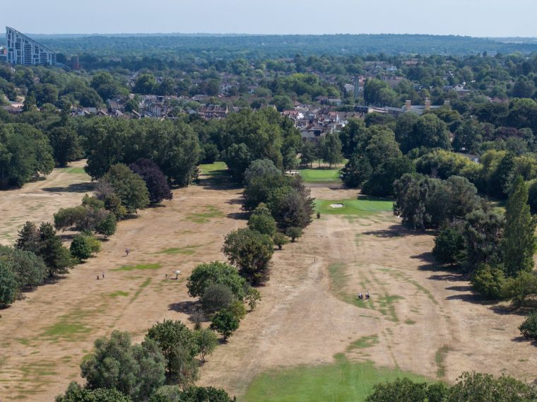 LONDON, ENGLAND - JULY 15: An aerial view of dried grass at Shortlands Golf club on July 15, 2026 in London, England. A new report from the Met Office, responsible for the country's weather forecasts, says that weather once regarded as extreme is now the new normal, showing that the hottest day of the year in the south of England is now typically 4.5C degrees warmer than it was between 1961 and 1990. The report also confirmed that 2025 was the warmest year on record since data started being collected in 1884. (Photo by Dan Kitwood/Getty Images)