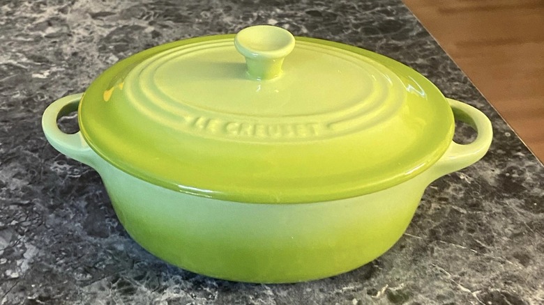 A Le Creuset mini oval cocotte in Kiwi