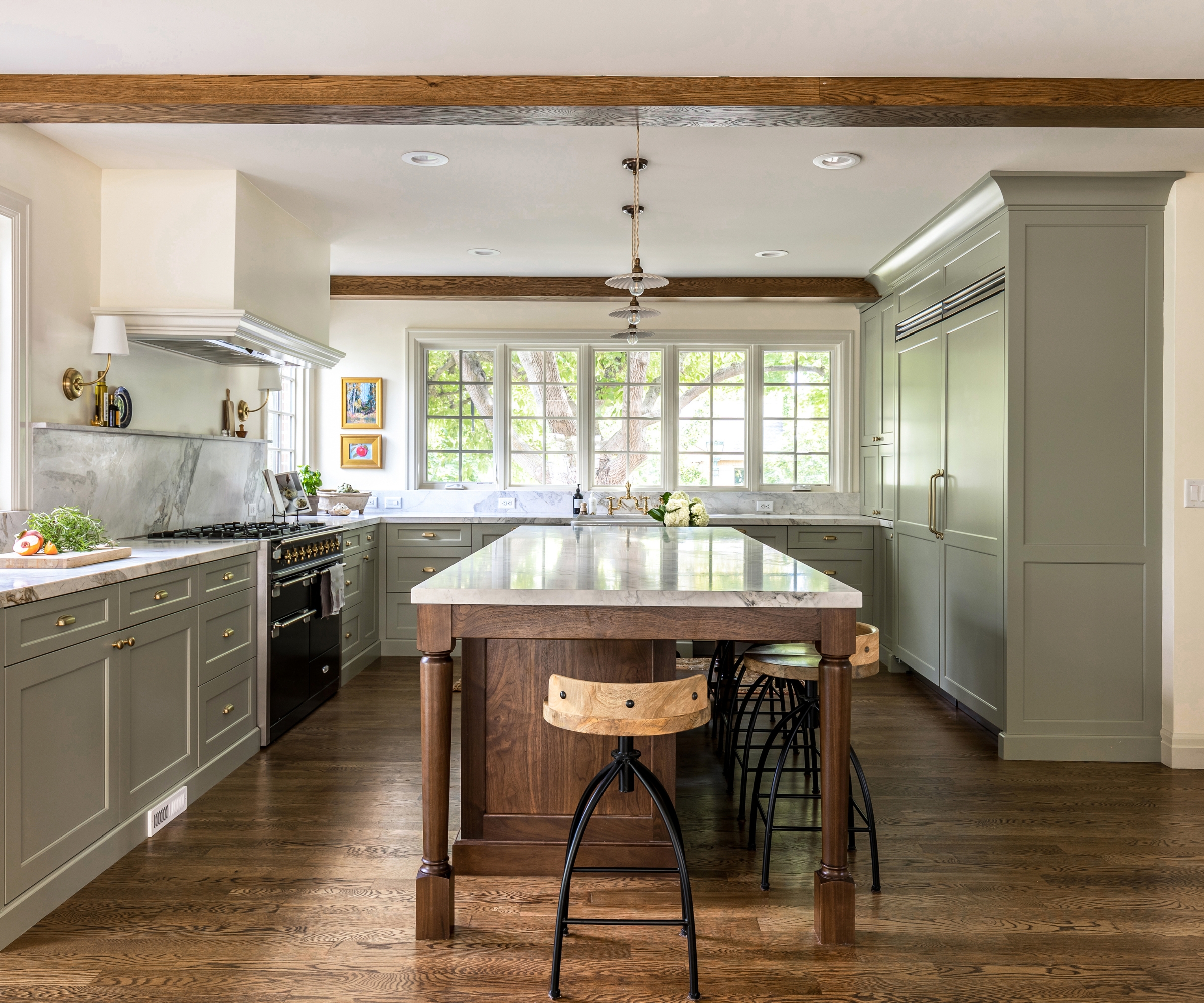 A U-shaped kitchen with cabinets painted French Gray by Farrow & Ball