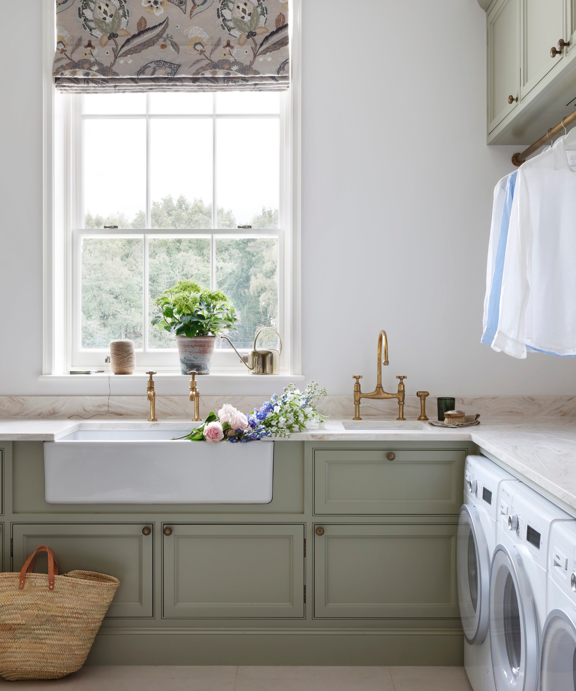 A laundry room with white walls and Farrow & Ball's French Grey for the cabinetry