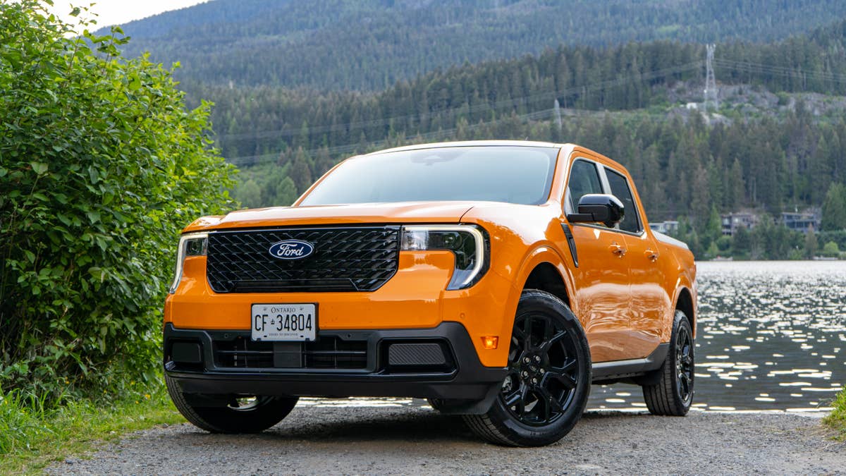 2026-ford-maverick-lariat-hybrid-in-orange-fury-front-angled-view