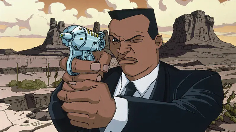Agent J getting ready to shoot something in the desert