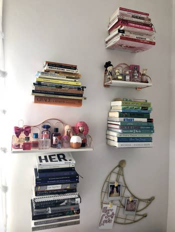 A collection of books are displayed on a wall