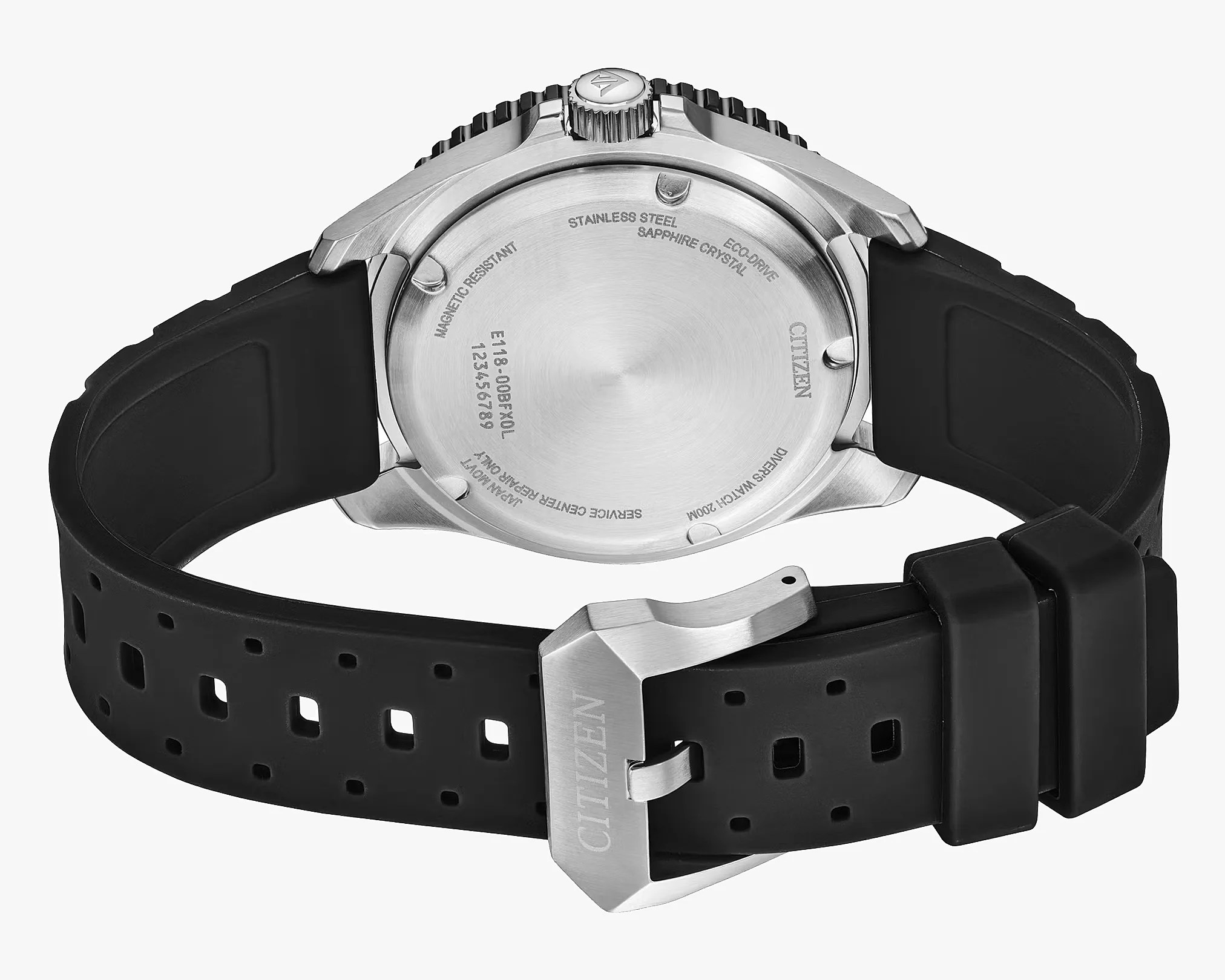 Back of a Citizen watch with stainless steel case, black rubber strap, and engraved text on the case back.