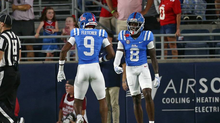 Mississippi Rebels defensive back Ricky Fletcher and defensive back Antonio Kite react after an interception.