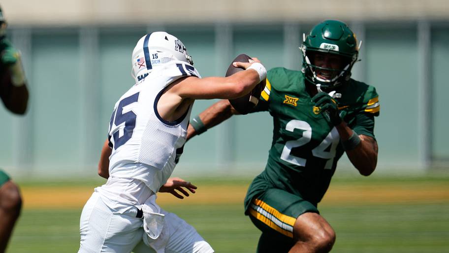 Samford Bulldogs quarterback Brady Stober (15) is pressured by Baylor Bears safety Micah Gifford