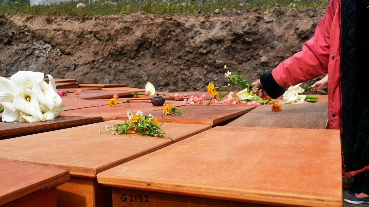 A close up of various wooden boxes with flowers on them
