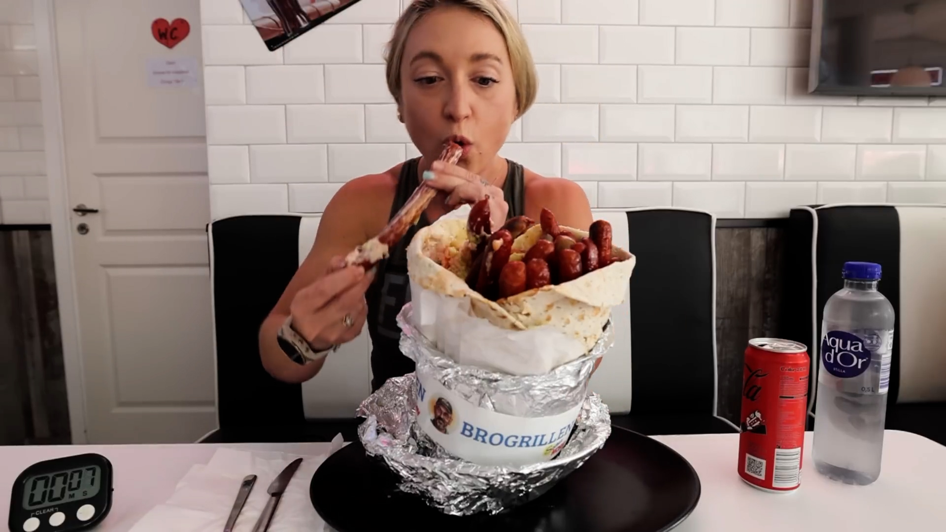 Girl tries to eat this 3kg Swedish wrap challenge with 20 sausages