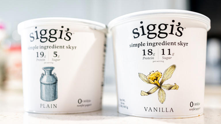 Reuse empty yogurt containers for a charming kitchen storage fix