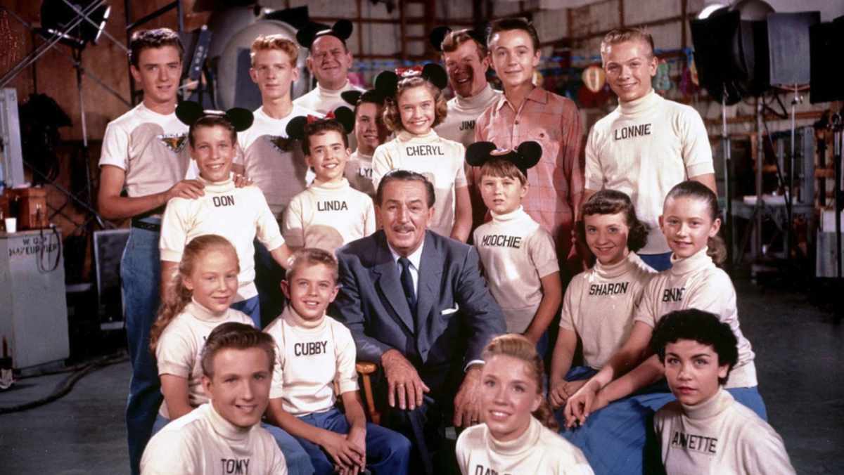 Walt Disney, Kevin Corcoran, Annette Funicello, Sharon Baird, Lonnie Burr, Tommy Cole, Tim Considine, Jimmie Dodd, Lynn Fields, Darlene Gillespie, Don Grady, Cheryl Holdridge, Tommy Kirk, Cubby O'Brien, Karen Pendleton, David Stollery, Roy Williams, Lynn Ready, and Linda Hughes in The Mickey Mouse Club (1955) (Image source: The Walt Disney Co.)