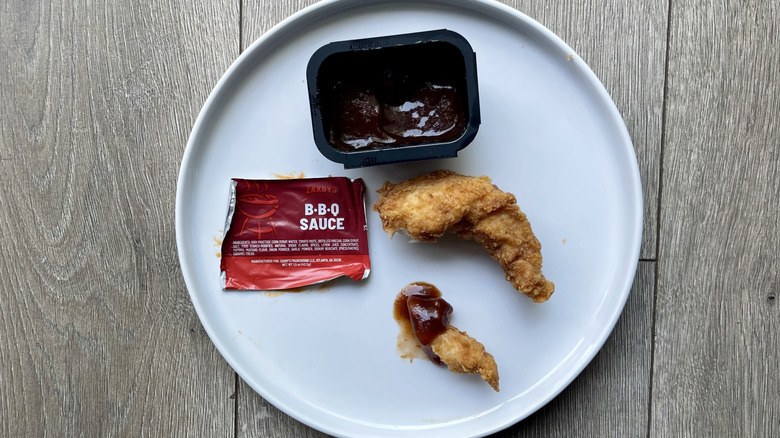 Chicken tender pieces with bbq sauce on a plate