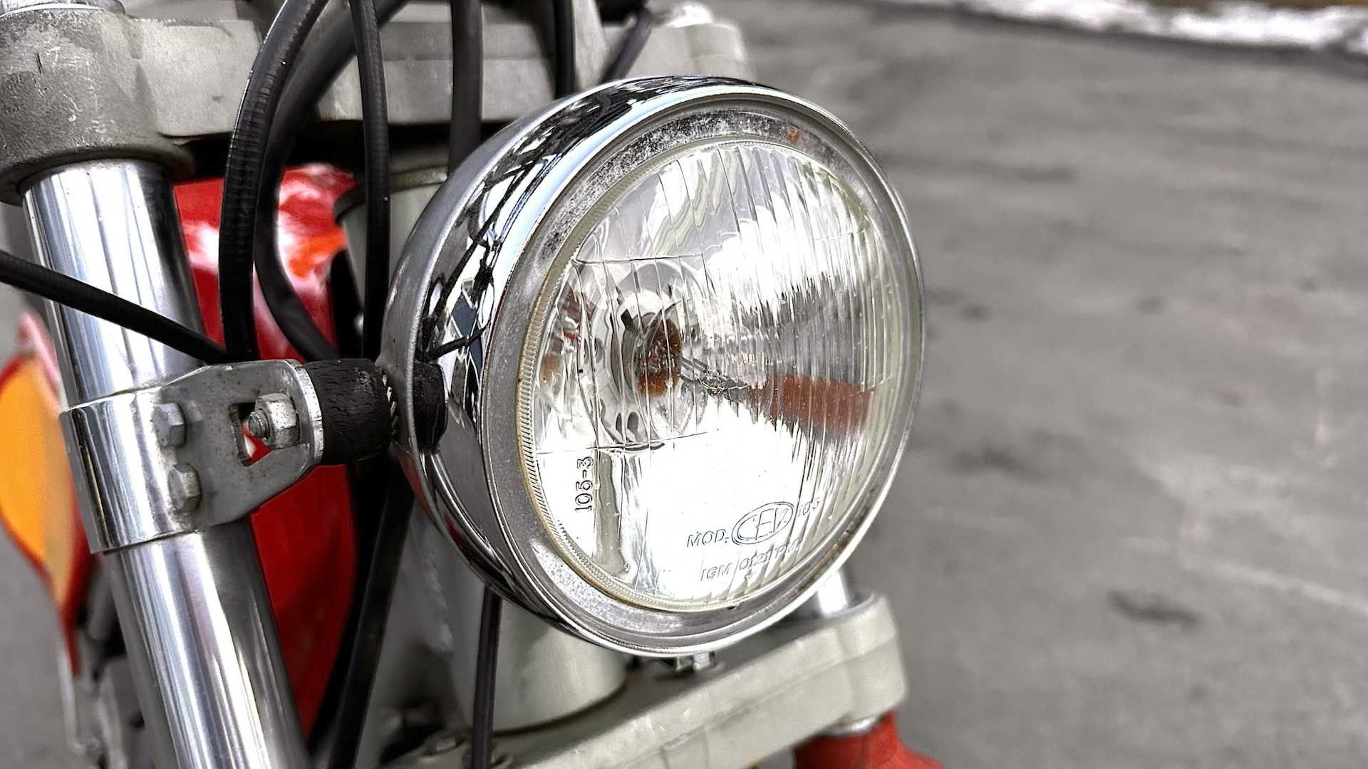 The headlight of a 1970s German motorcycle
