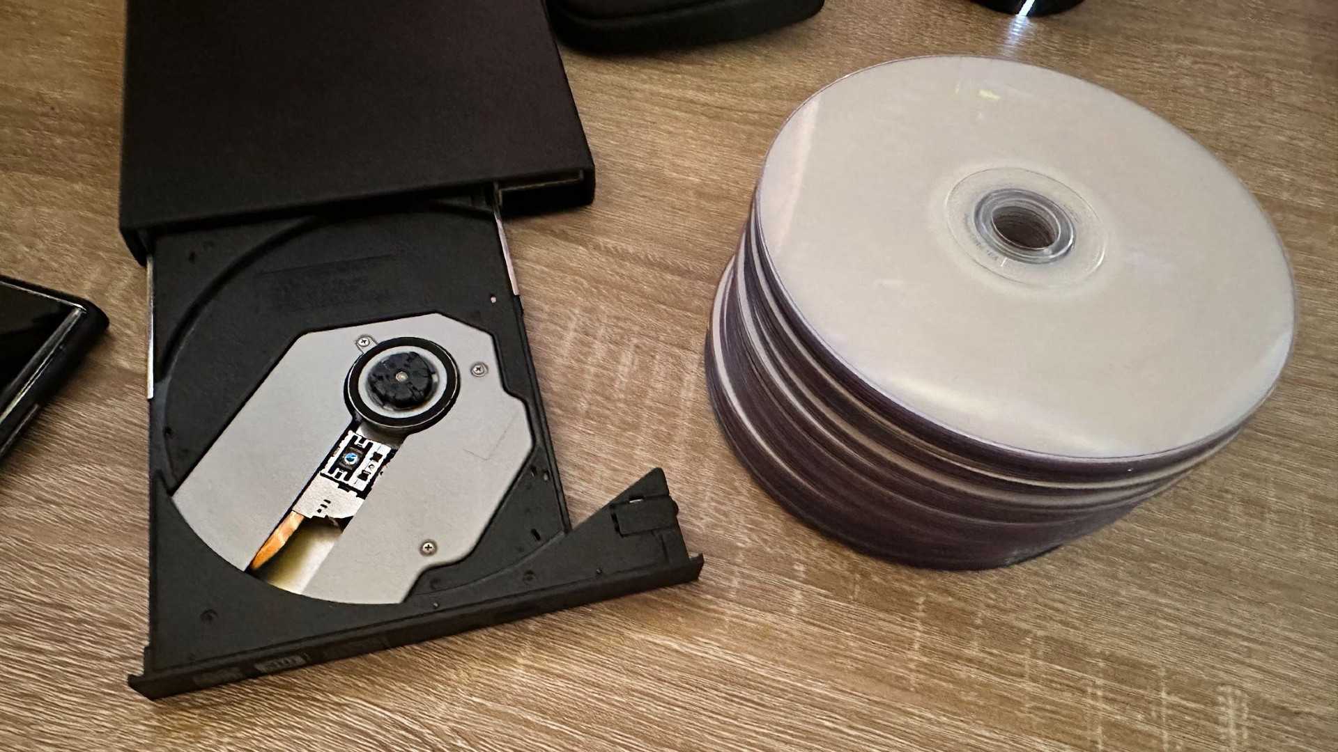 DVD burner with pile of blank discs