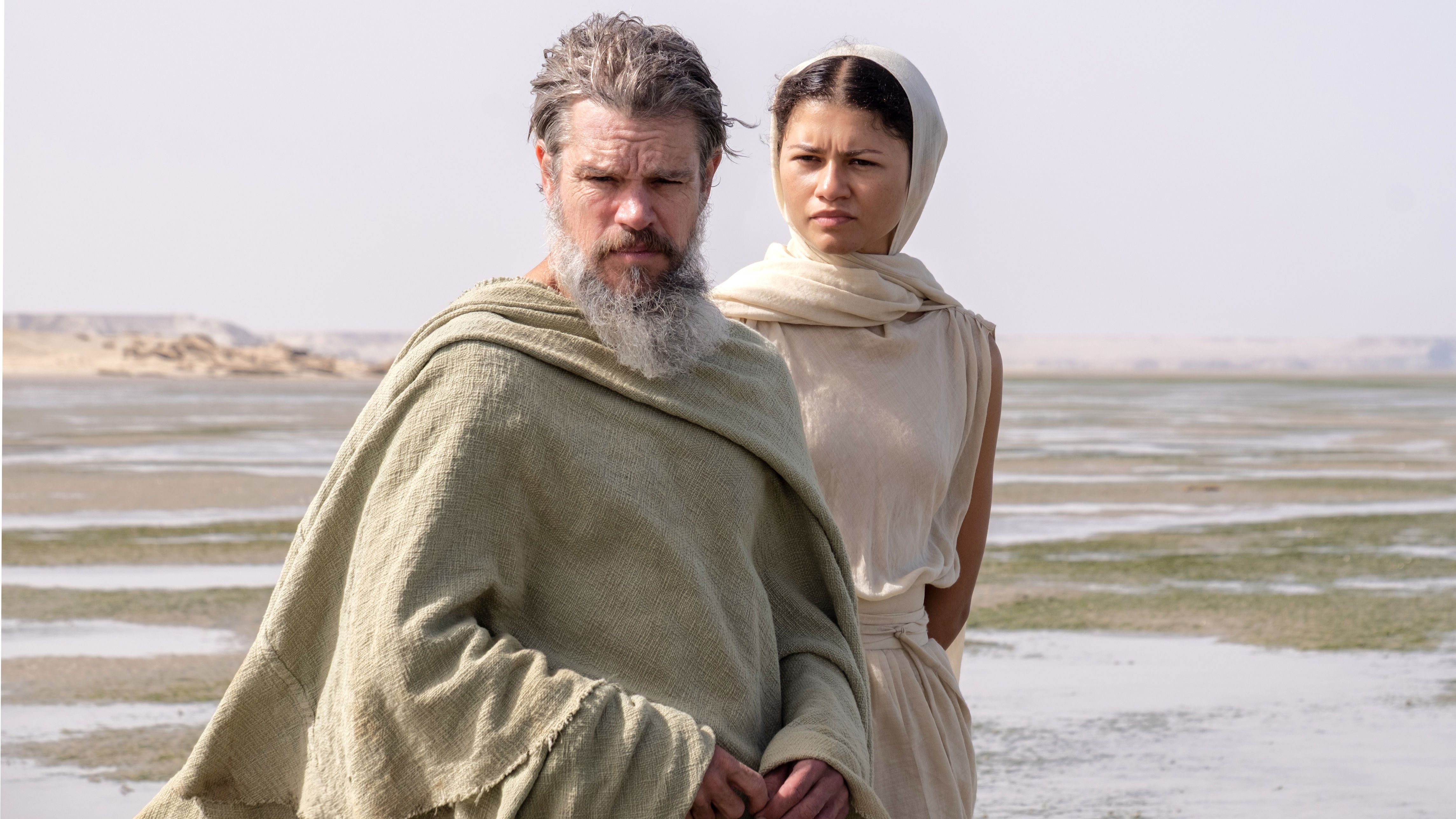 (L-R) Matt Damon as Odysseus and Zendaya as Athena in