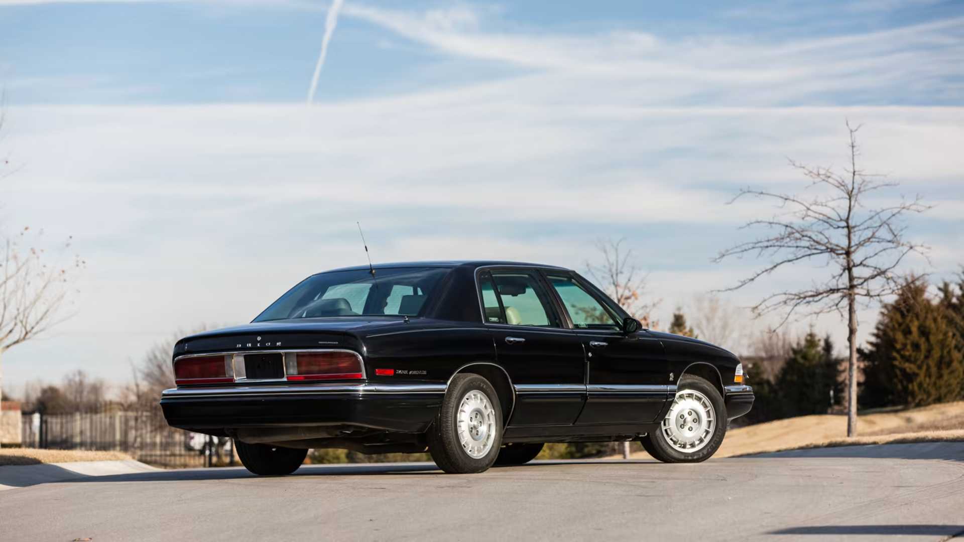 Black 1996 Buick Park Avenue rear 3/4 shot parked