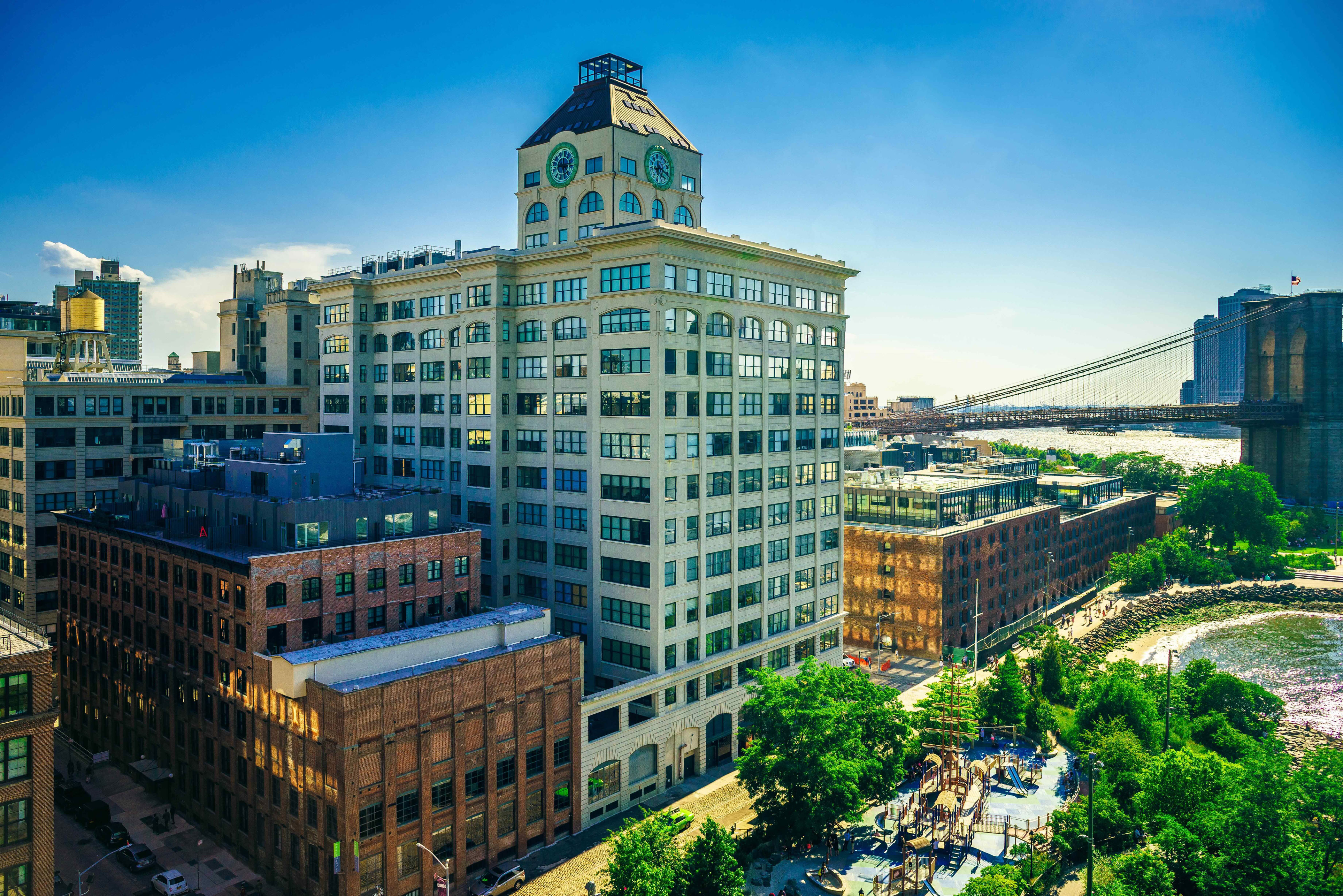 Brooklyn's Dumbo and the Brooklyn Bridge Park, seen from the Manhattan Bridge on a hot summer afternoon.