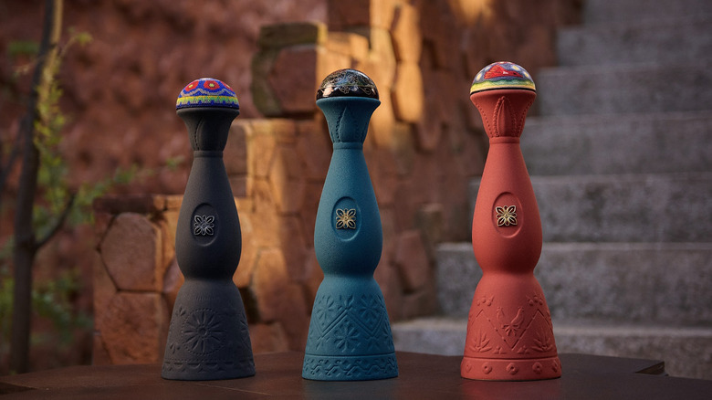Clase Azul bottles in black, blue, and red