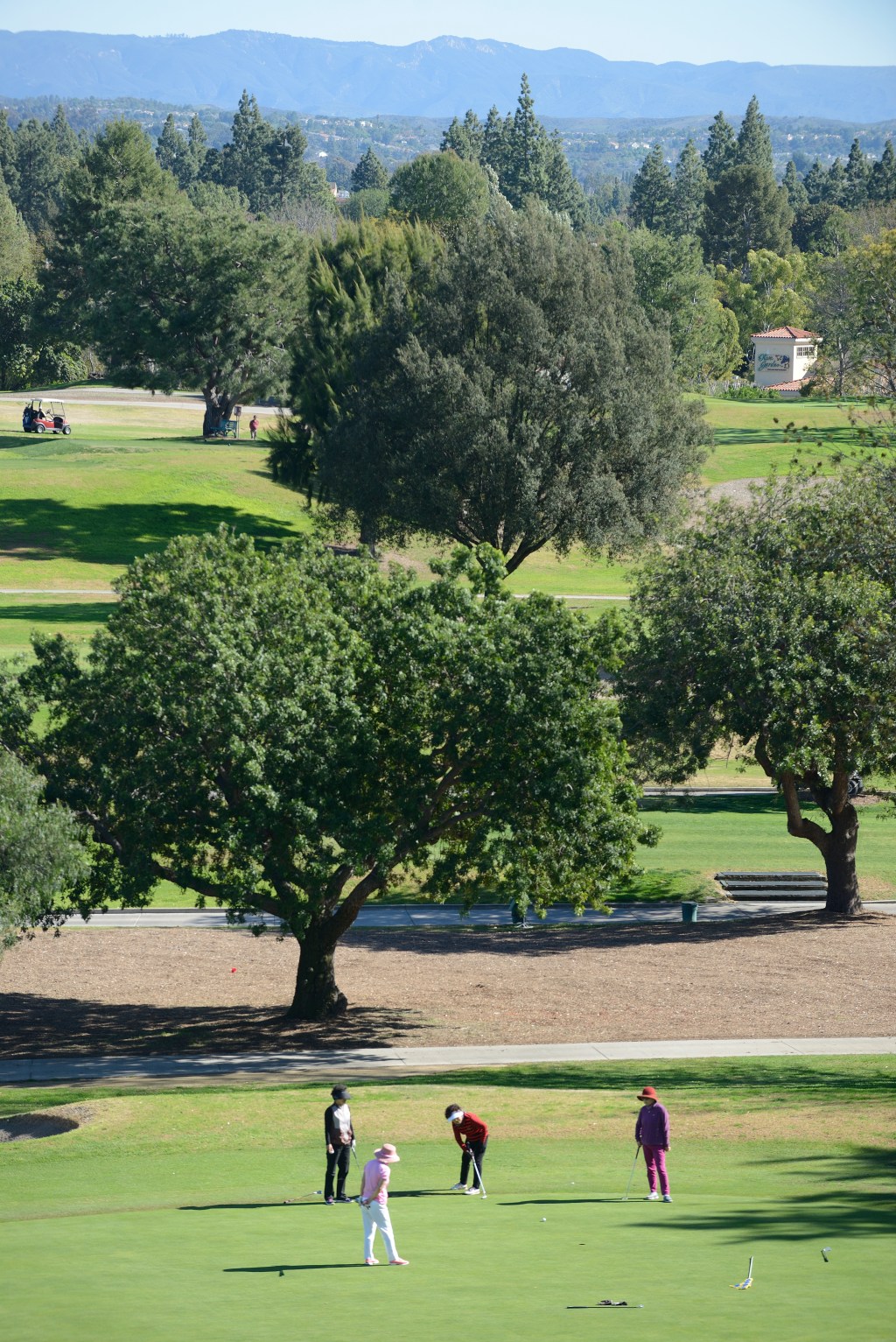 golfers-work-putting-laguna-woods-134624600