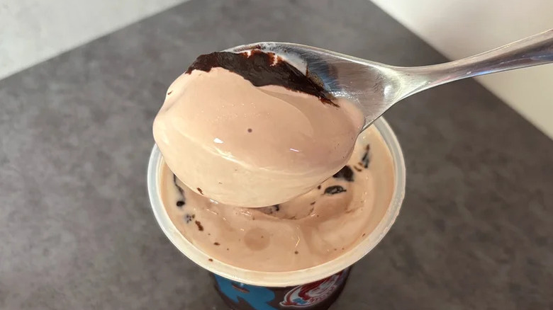 A spoon with Wendy's Brownie Batter Chocolate Frosty Swirl