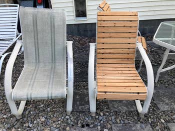 Two outdoor lounge chairs with metal frames and slatted seats on a pebble patio; one has a fabric seat, and the other has wooden slats