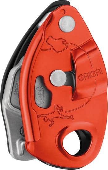 orange grigri belay device with markings for the rope end and climber end