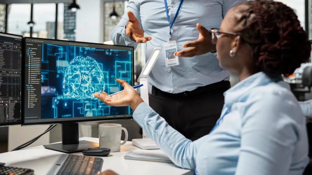 Manager supervising work of financial expert in office