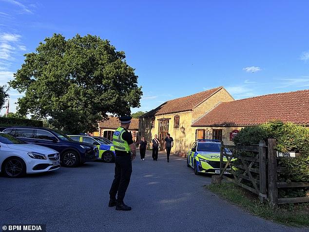 The boy's family have now provided an update on his recovery process, revealing one of his hands was left without function after the attack. Pictured: Police at the scene on the day of the assault