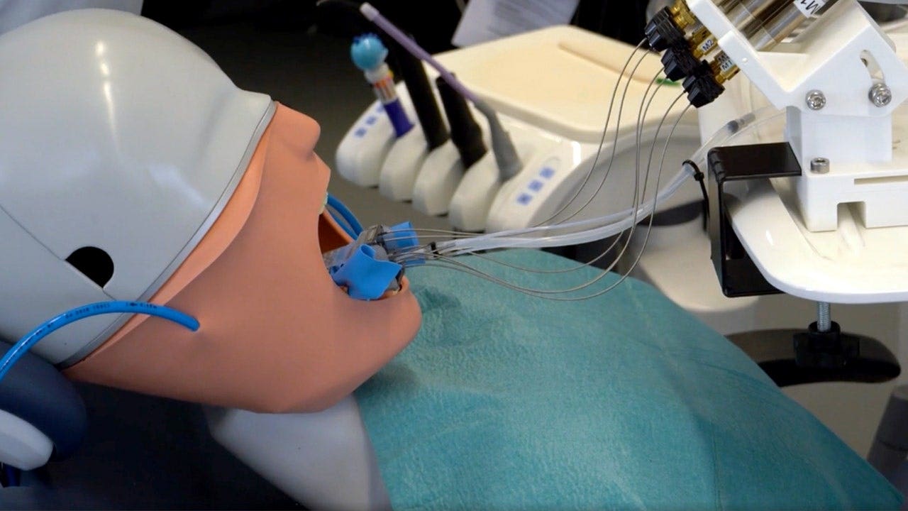 The dental robot being tested on a synthetic tooth model.