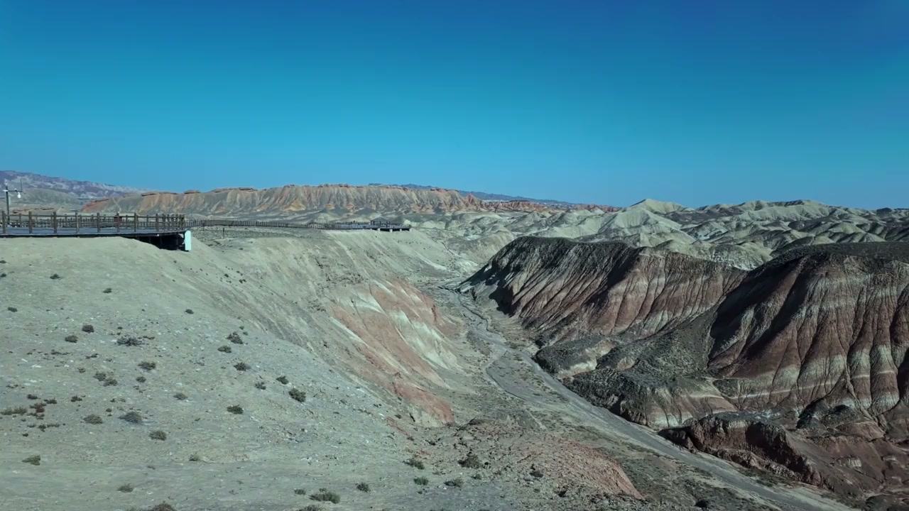 Zhangye Binggou Danxia, China: Drone soars over red rock canyons