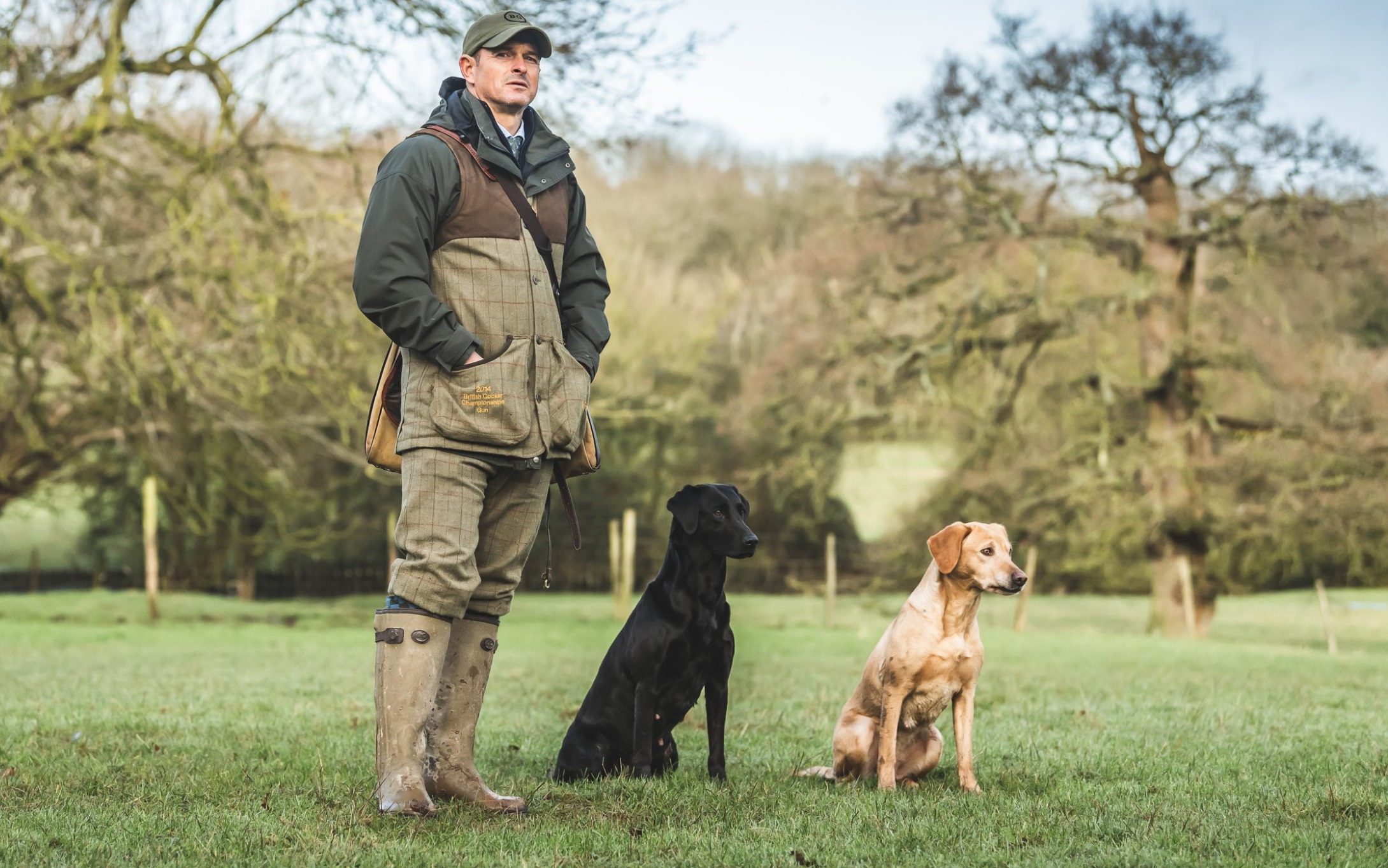 Ben Randall with two gun dogs