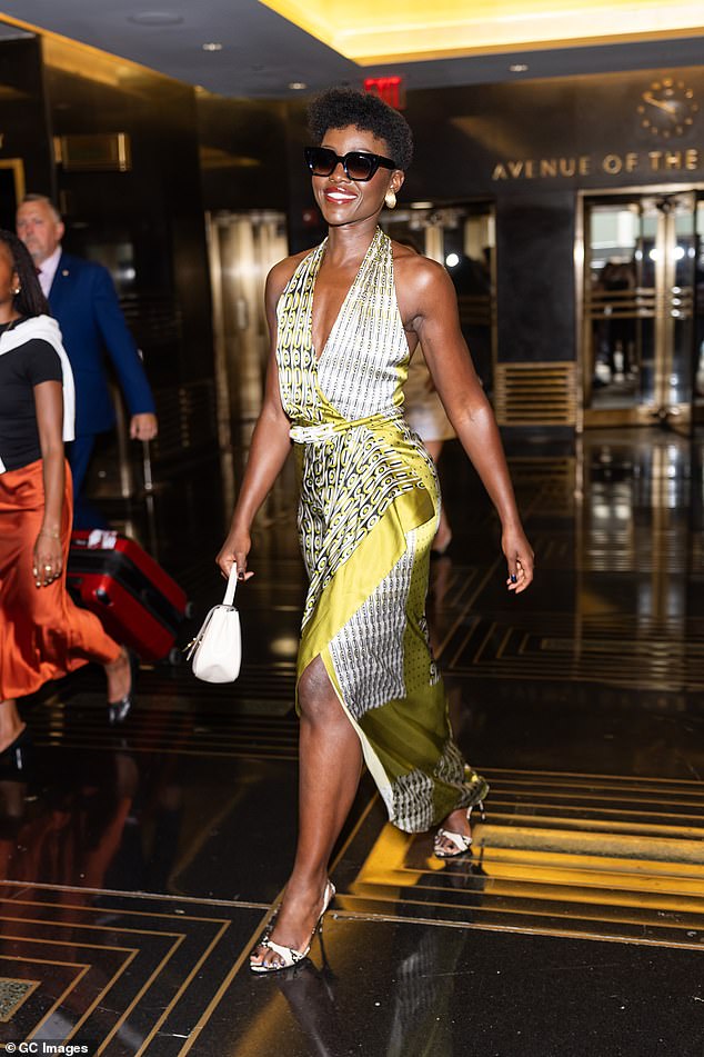 The Oscar winner looked gorgeous in a silk halterneck dress as she left her Midtown hotel for another round of press to promote Christopher Nolan's epic movie