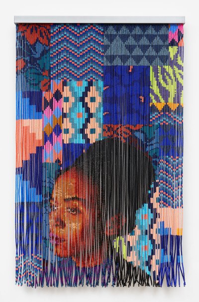A beaded portrait of a Black woman with a background that has various patterns that are mostly blue.